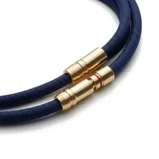 Two navy cables with brass connectors plugged together.