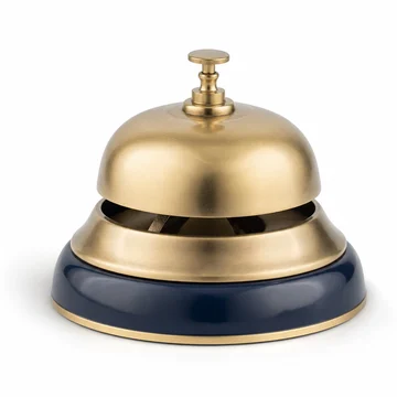 A brass desk service bell on a navy base.